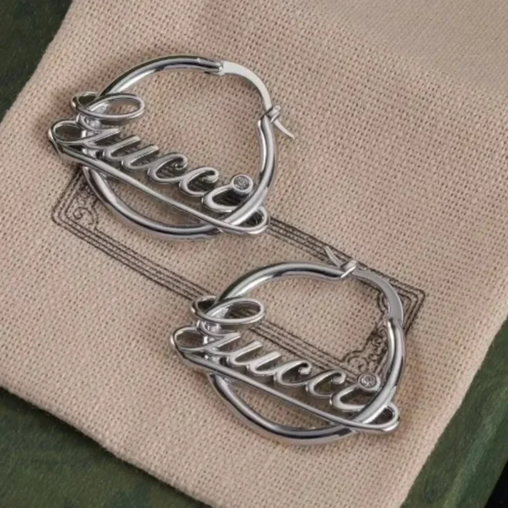 Silver Cursive Logo Hoop Earrings - Picture 1 of 2